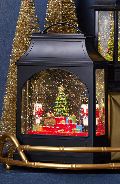 nutcracker water lantern arranged on a gold tray with golden trees.