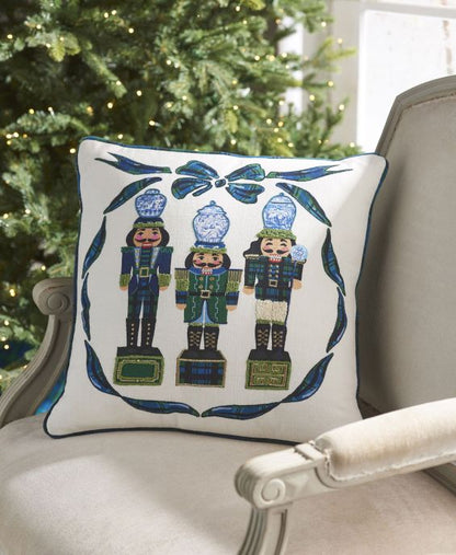 nutcracker pillow set on a white armchair.