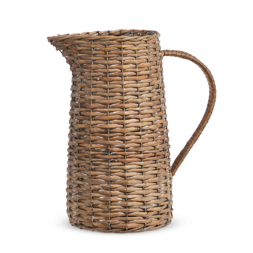 large woven pitcher on a white background.