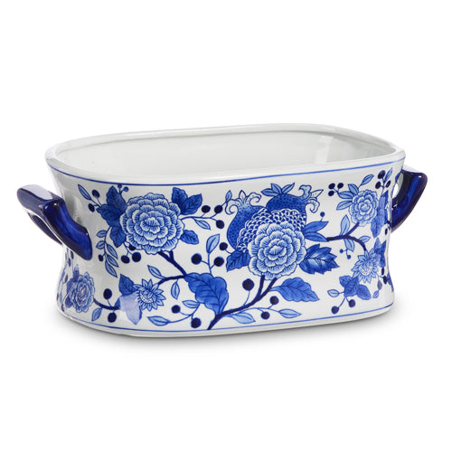 square bowl with side handles and a blue and white floral design.
