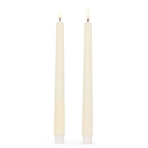 11 inch ivory taper candles with flame on.