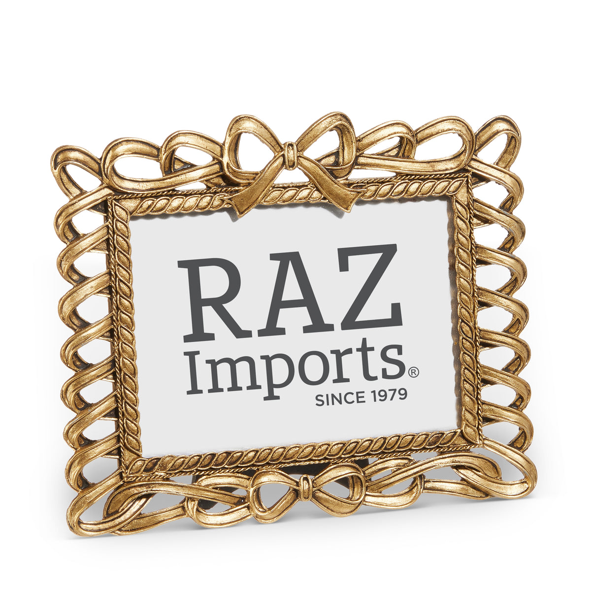 gold bow and ribbon looking picture frame on a white background