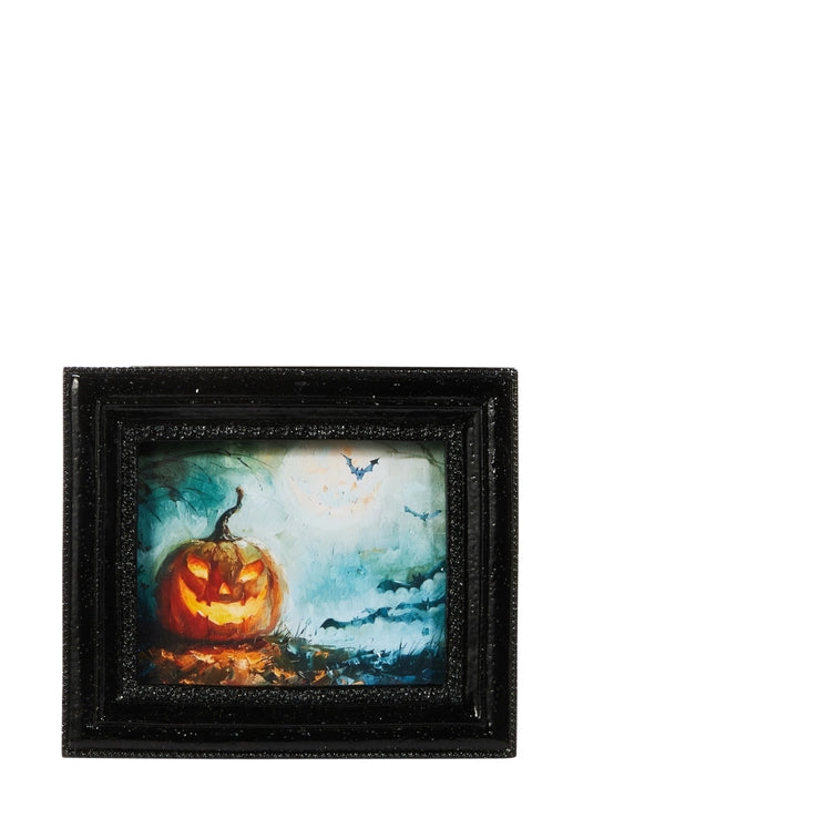 small halloween themed art print of a glowing jack-o-lantern set against a spook night sky in texture black frames