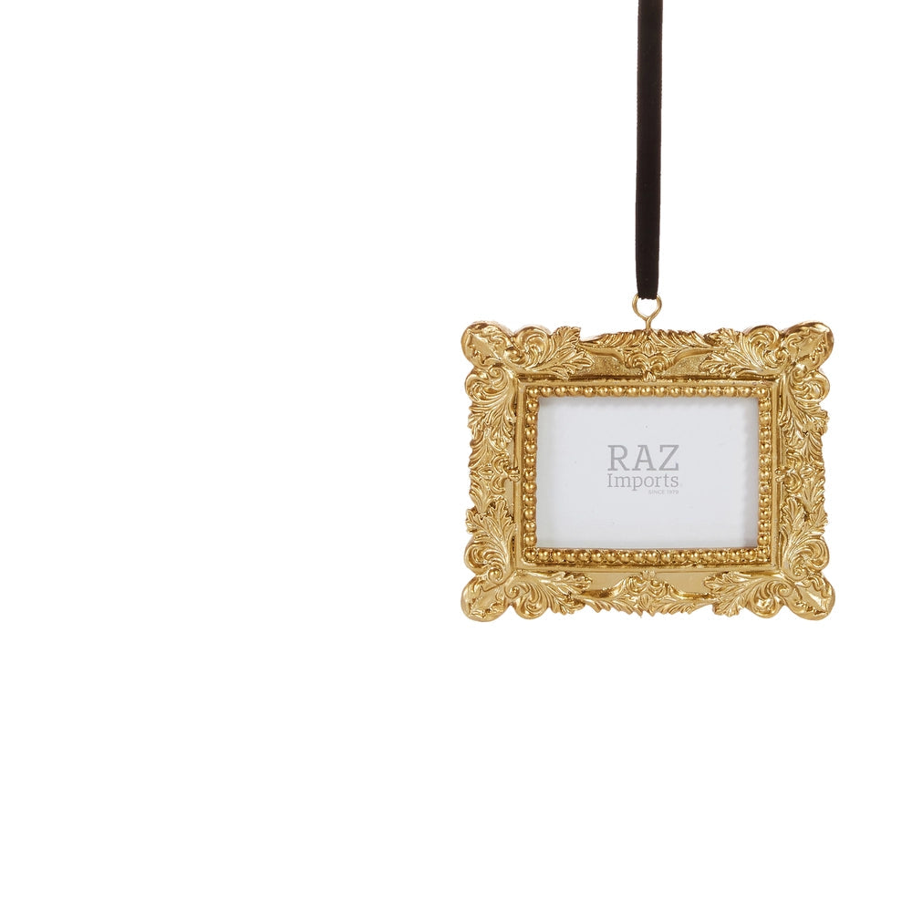 rectangle gilded gold frame ornament hanging on a white background by a black ribbon