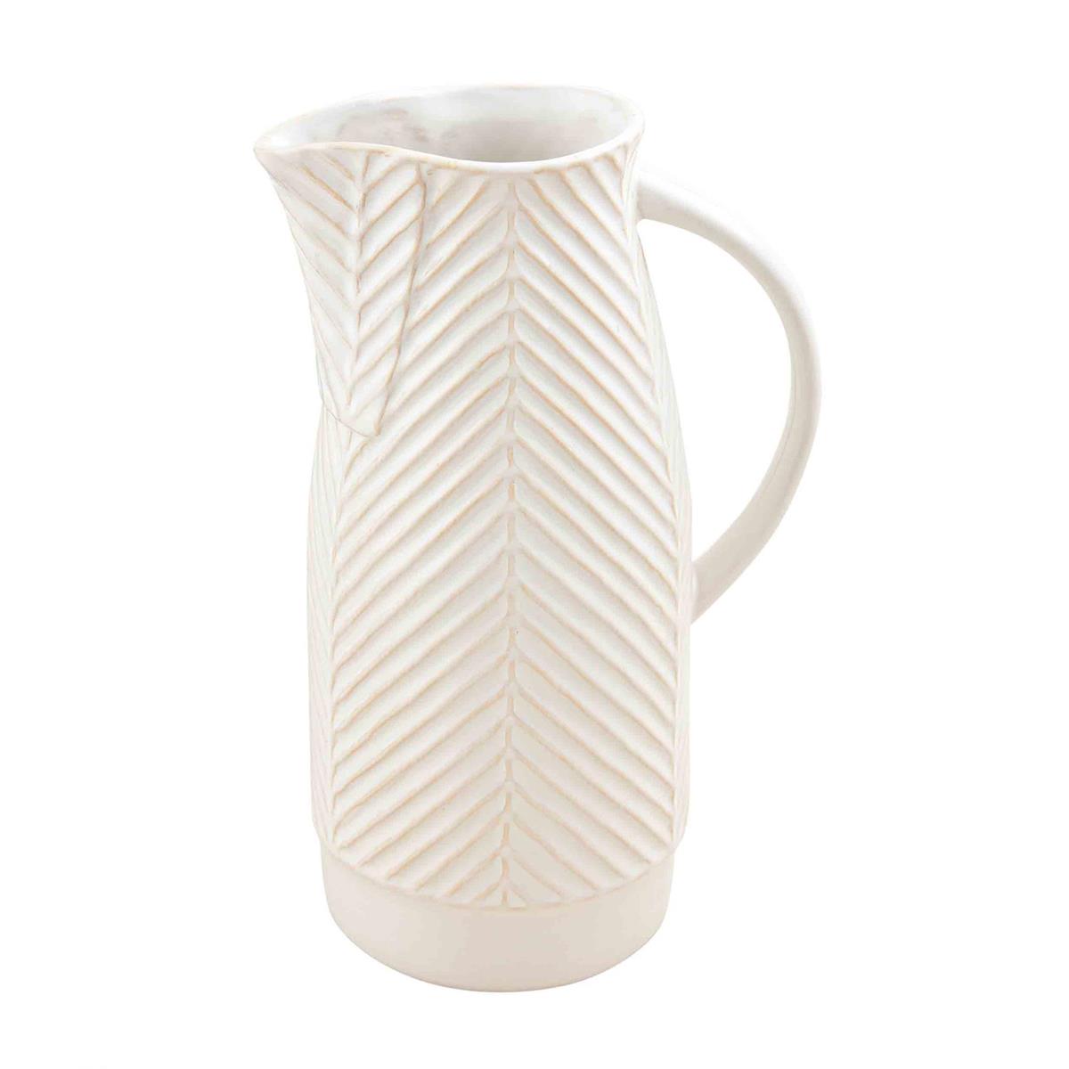 textured pitcher on a white background.