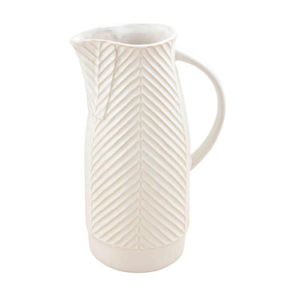 textured pitcher on a white background.