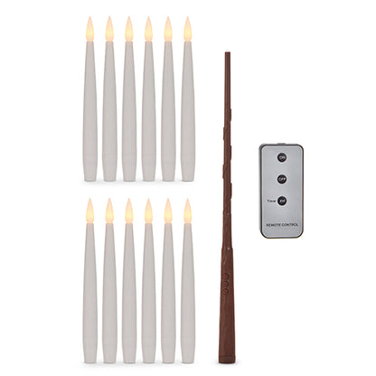 set of magic candles with remote and magic wand arranged on a white background