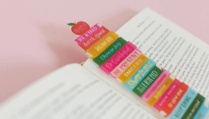 close-up of Affirmations Book Stack Transparent Bookmark laying on a n open book