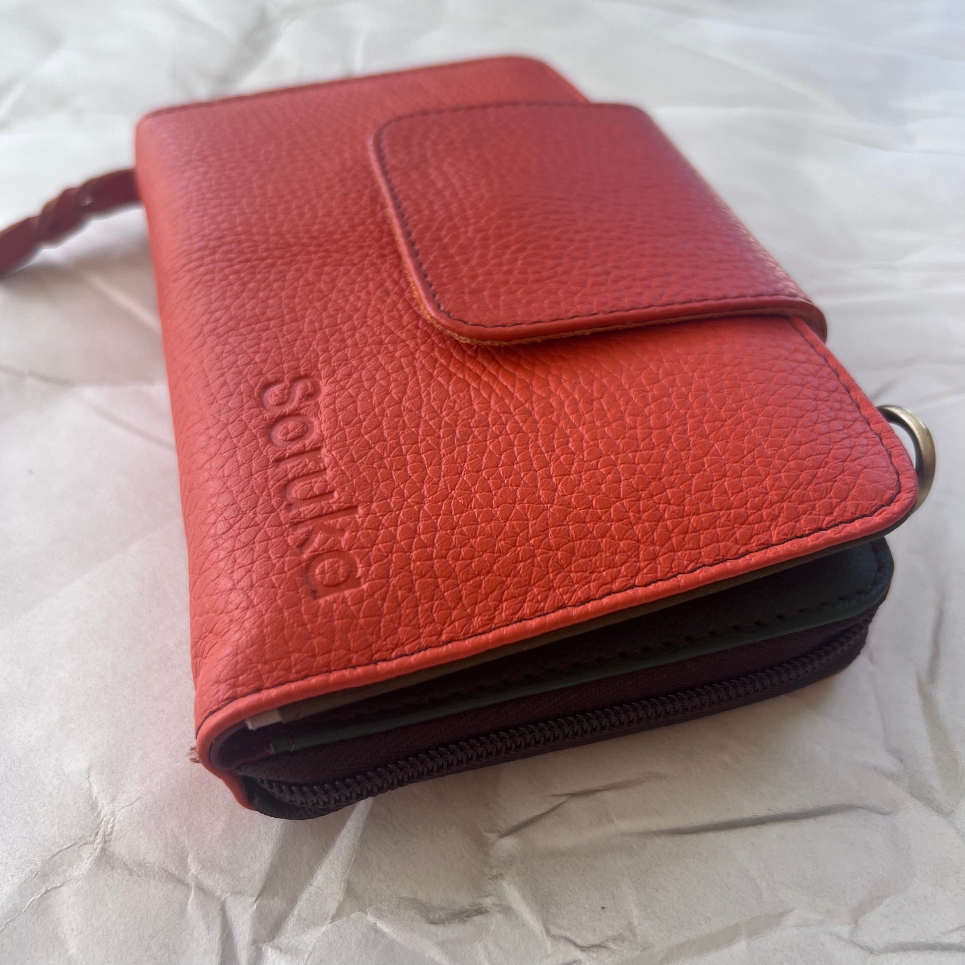 side view of orange Beatrice Clutch