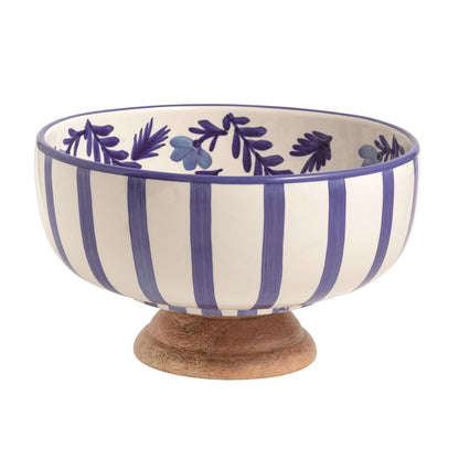 blue and white stripe bowl with a wooden base