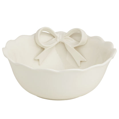 white ceramic bowl with a ceramic bow attached shown on a white background