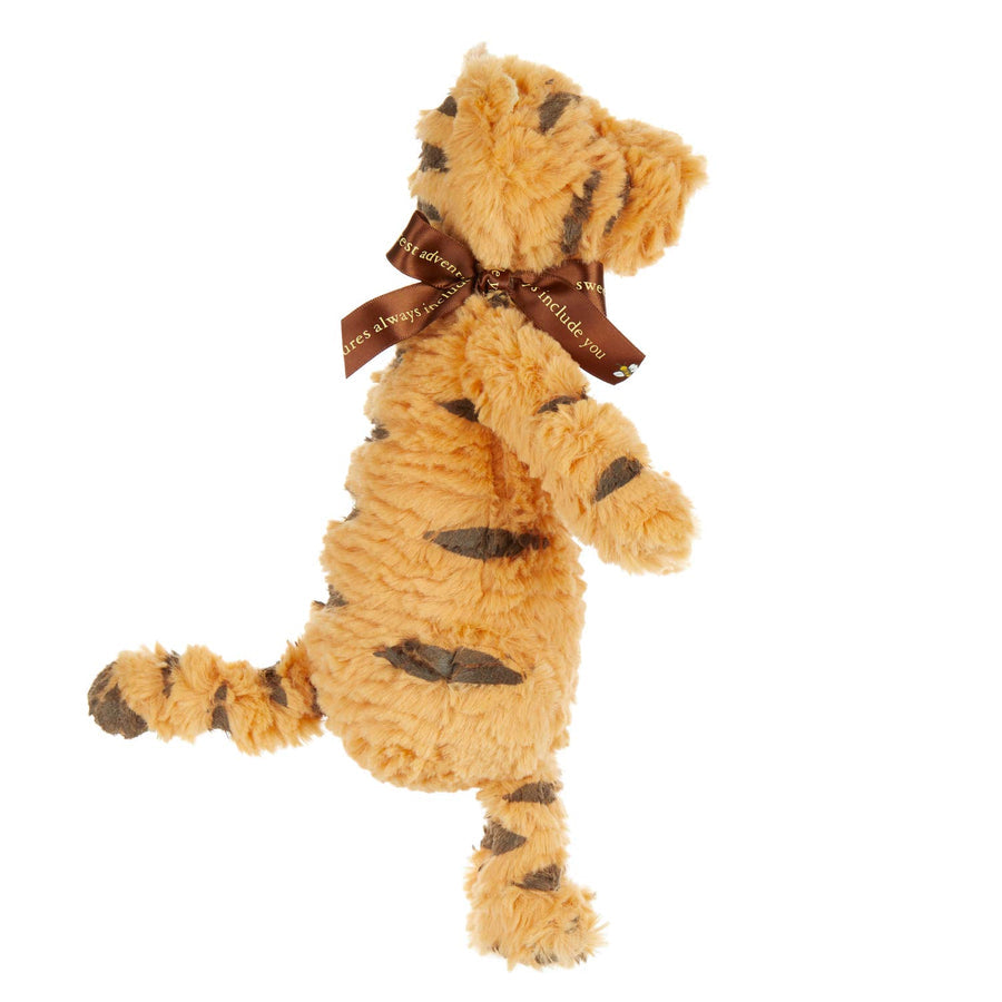 side view of classic tigger plush toy displayed against a white background