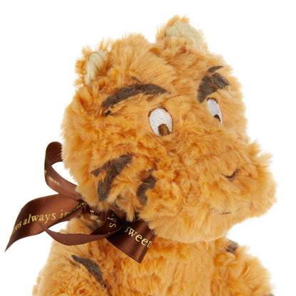 close-up of classic tigger plush toy displayed against a white background