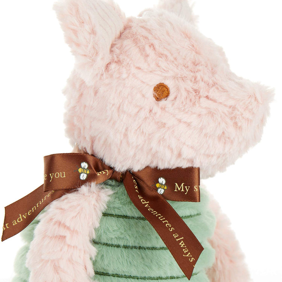 close-up of Disney Baby Classic Piglet Plush Toy sitting against a white background.