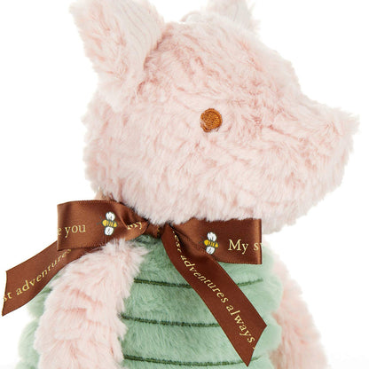 close-up of Disney Baby Classic Piglet Plush Toy sitting against a white background.