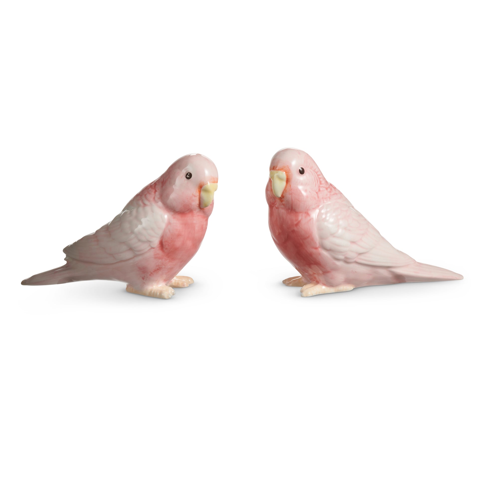 2 pink ceramic parrots on a white background
