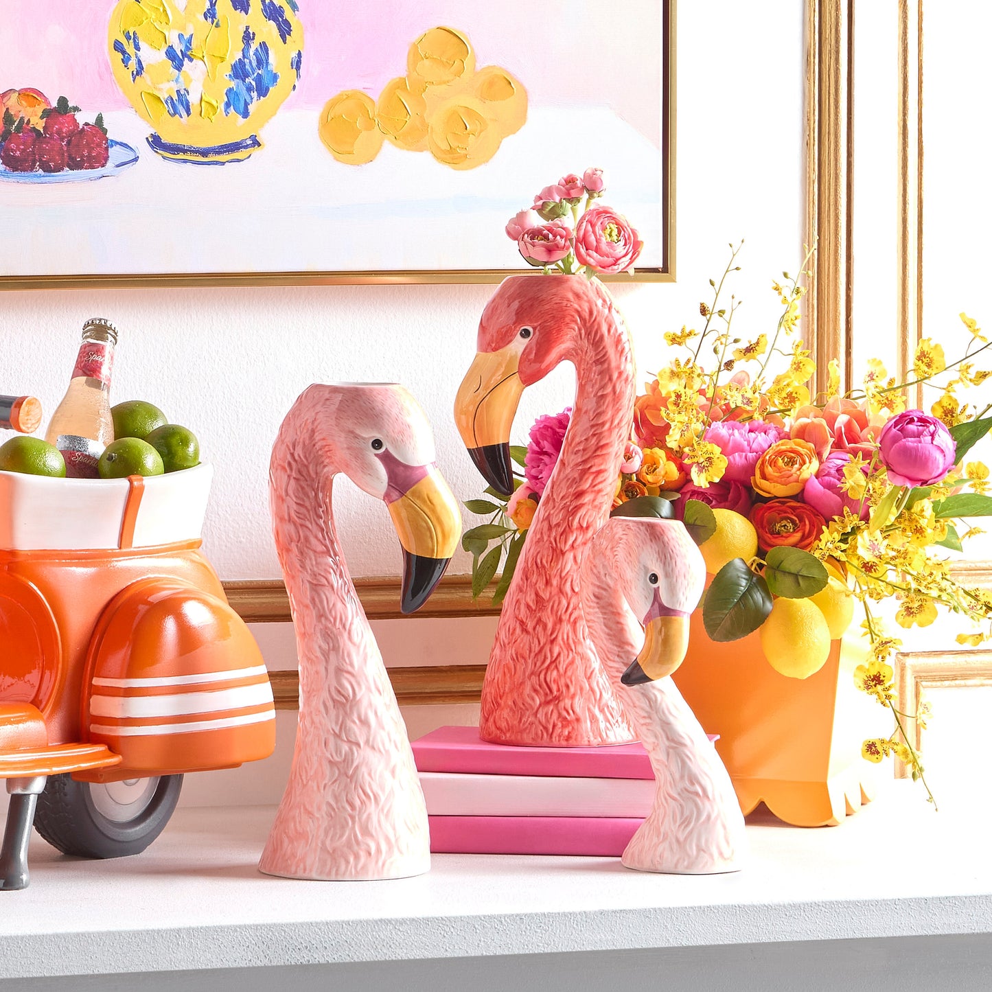 3 flamingo head vases in a decorated setting