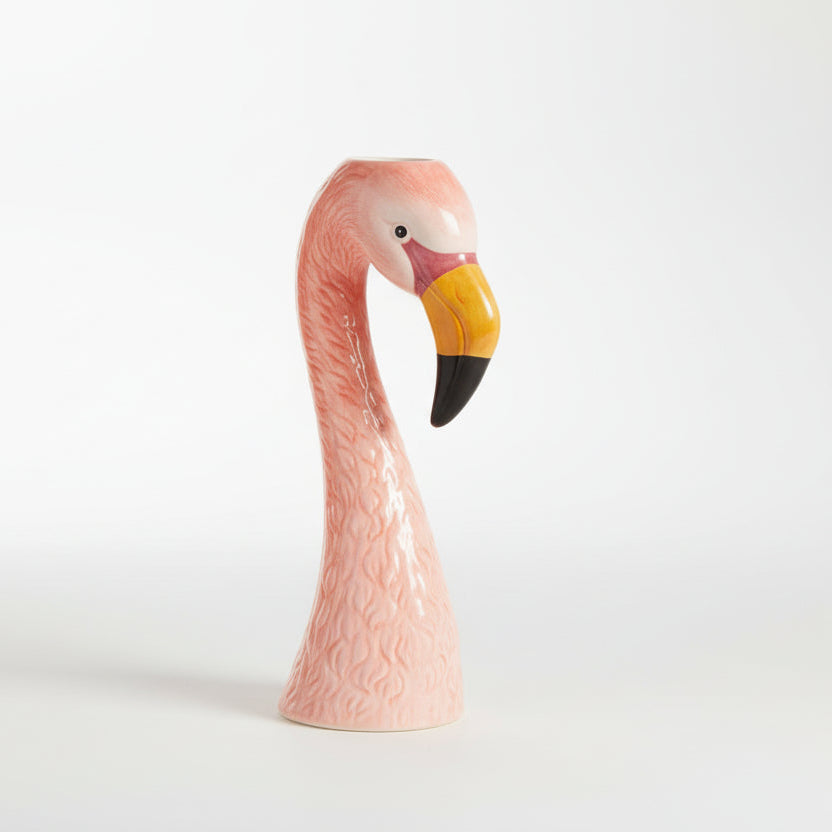 Pink flamingo-shaped vase on a white background