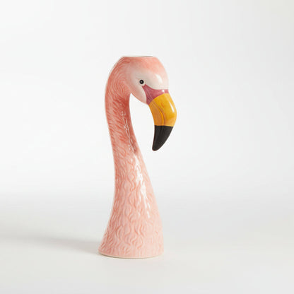 Pink flamingo-shaped vase on a white background