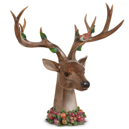 Deer head sculpture with large antlers and fruit filled neck band shown on a white background