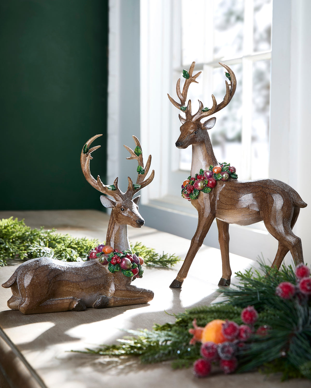 2 enchanged deer on a decorated table