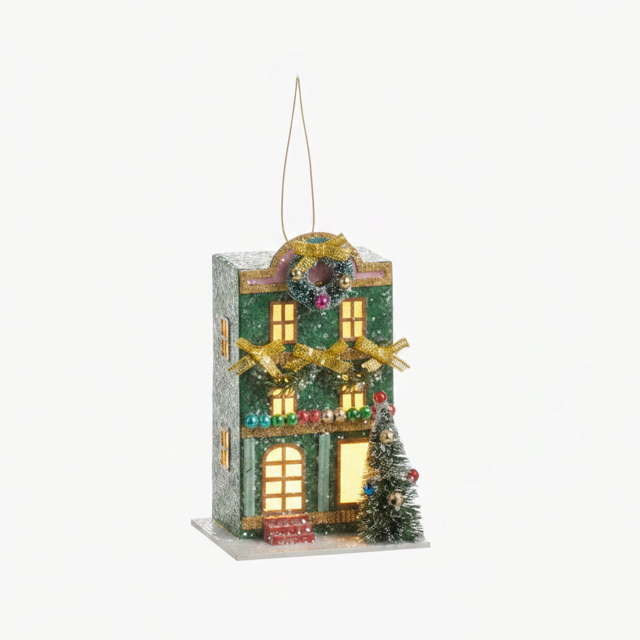 green house ornament decorated for christmas with lights in the  windows