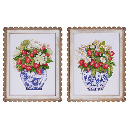 2 framed art pieces with blue and white vases fulled with flowers and red strawberries
