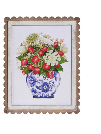 scalloped framed art with print of strawberries and white florals in white vase with blue flowers
