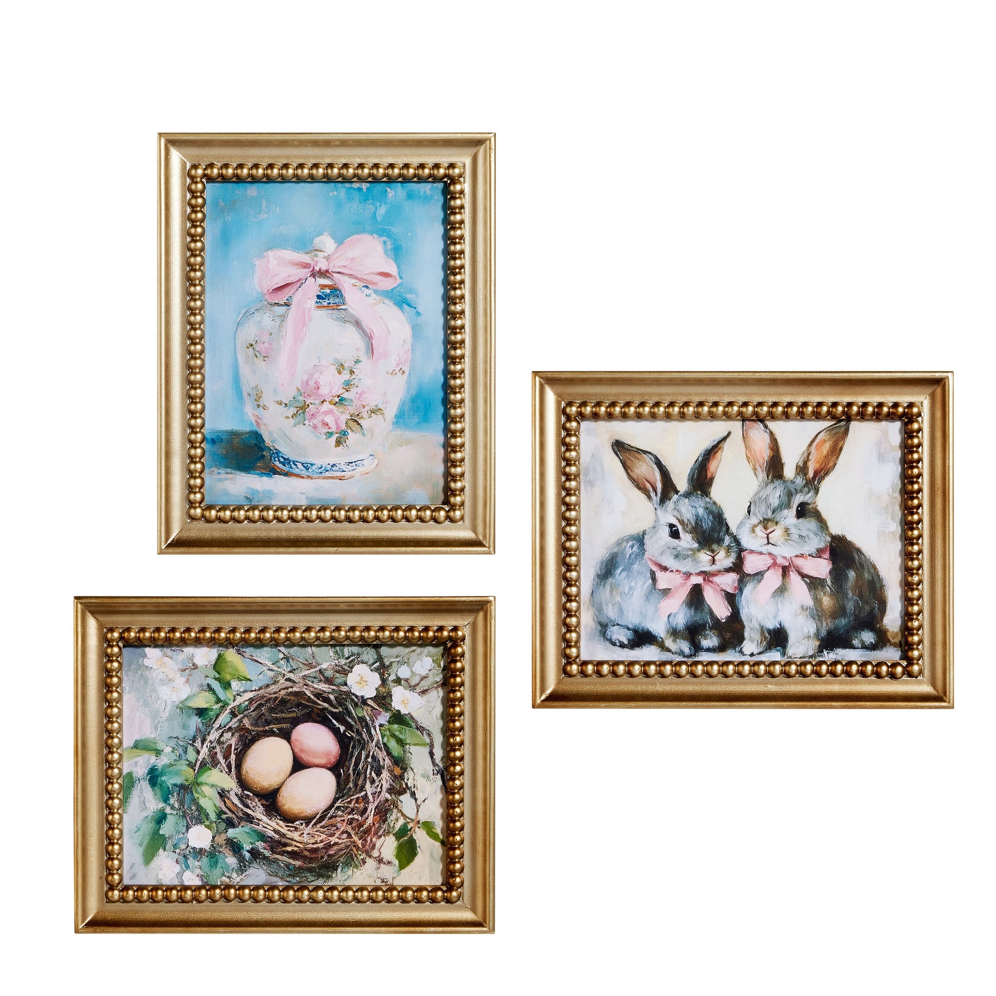 3 gold framed art pieces one of a ginger jar, one of a nest, and one of two bunnies