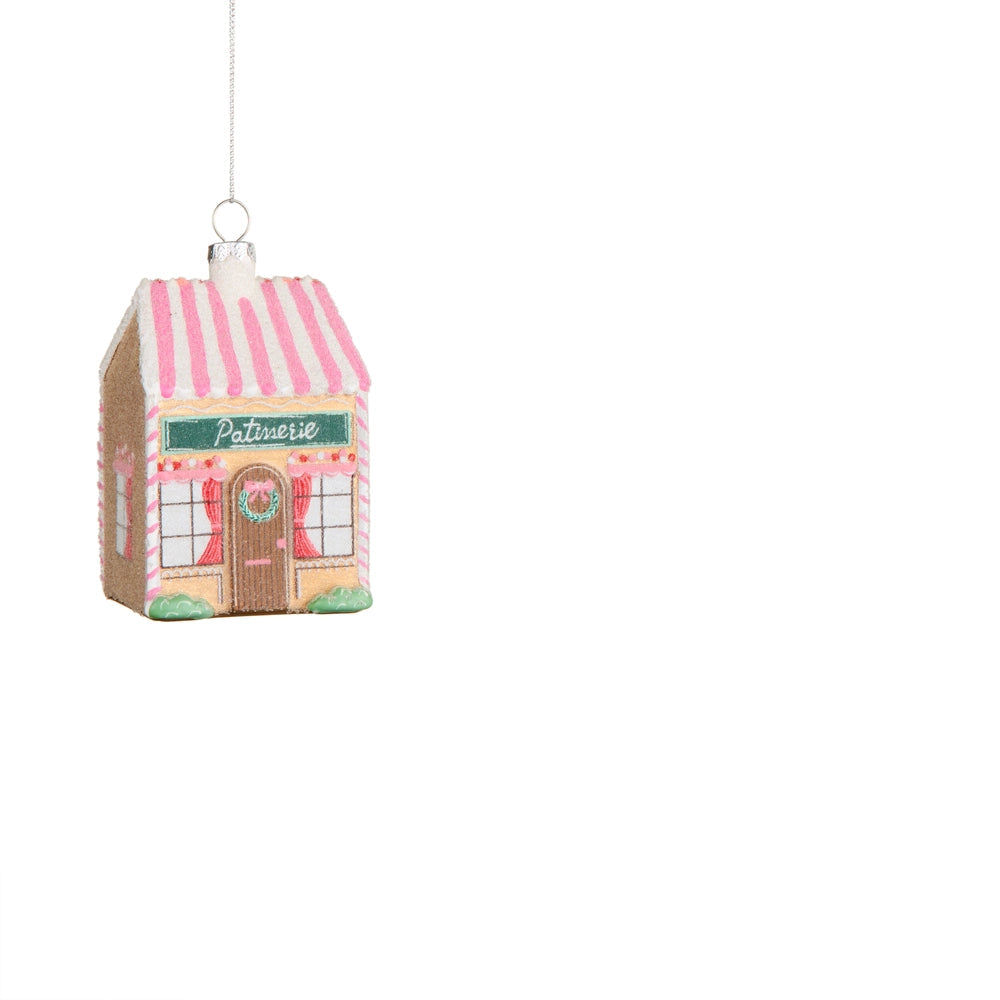 "patisserie" house ornament with a pink striped roof, candy style details and a wreath on the door.