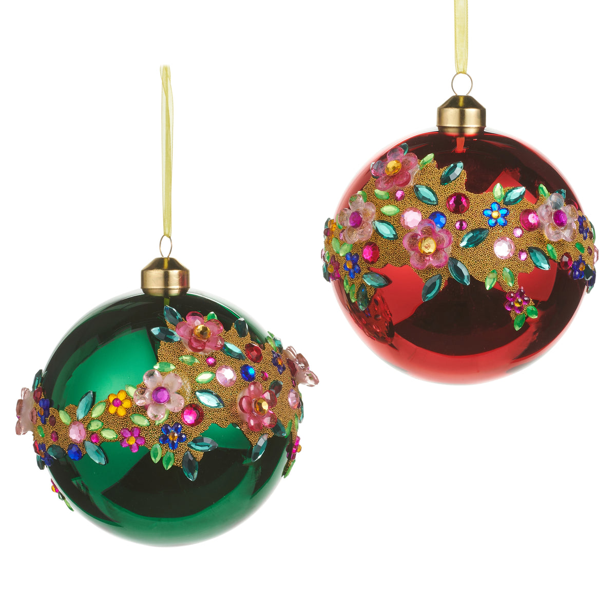 a green bejeweled floral ornament next to a red bejeweled floral ornament