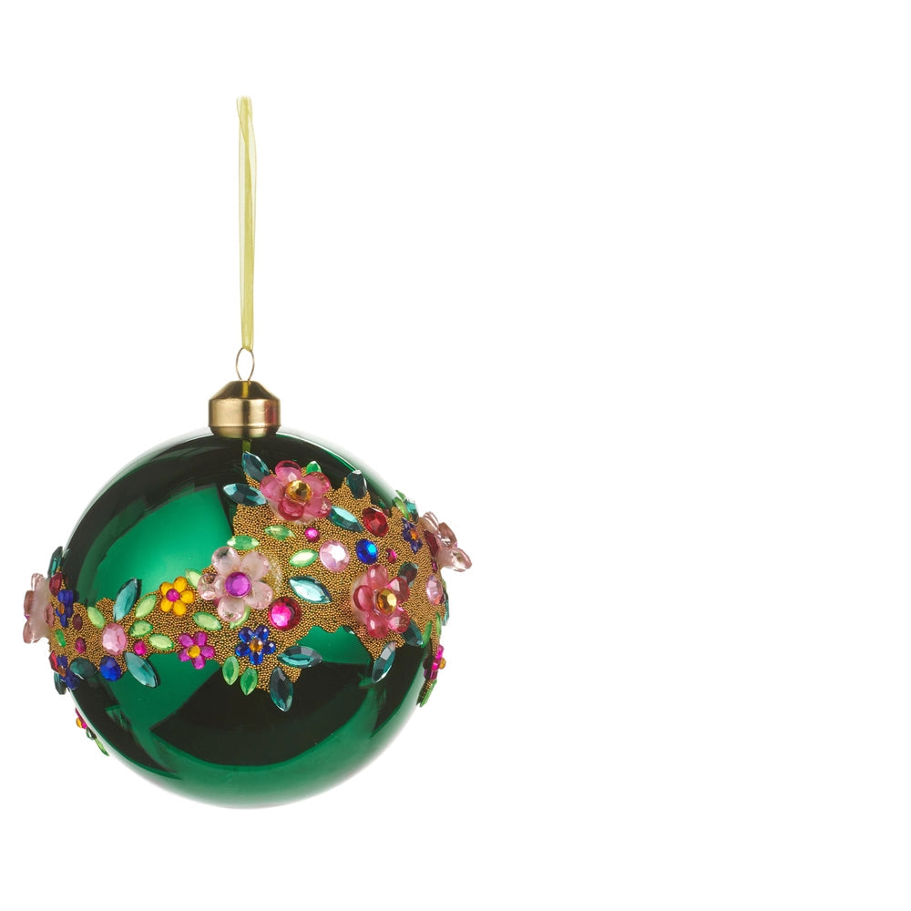 green glass ball ornament with jeweled floral design swirling across it