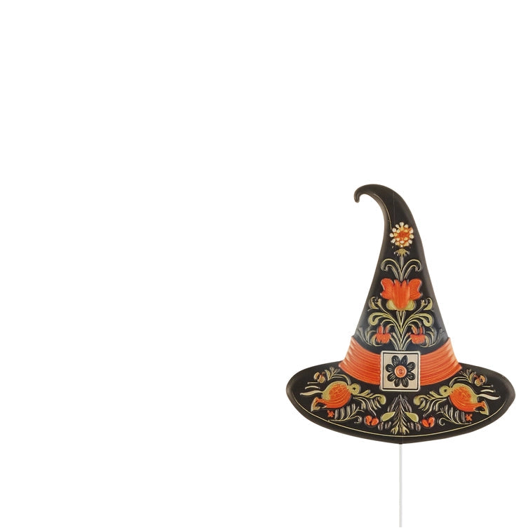 A decorative witch hat stake decoration with a black base and colorful hand-painted floral motifs in orange, yellow, and green, shown on a plain white background.