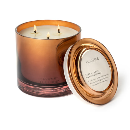 Terra Tabac Statement Glass Candle with its lid next to it on a white background