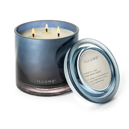 Hidden Lake Statement Glass Candle with the lid next to it on a white background