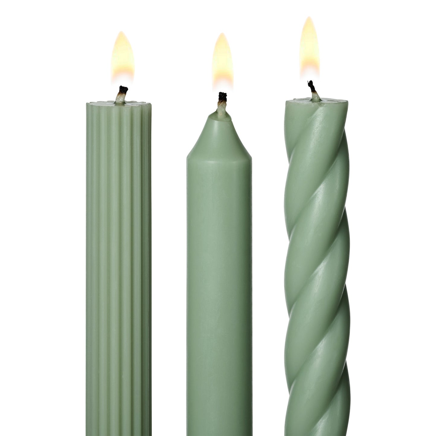 three lit assorted green taper candles on a white background