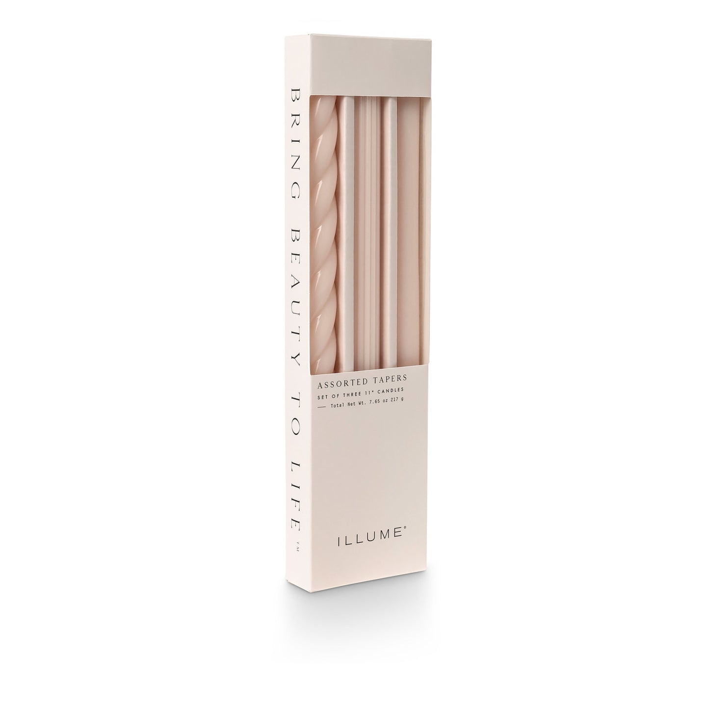 three assorted blush taper candles in their packaging