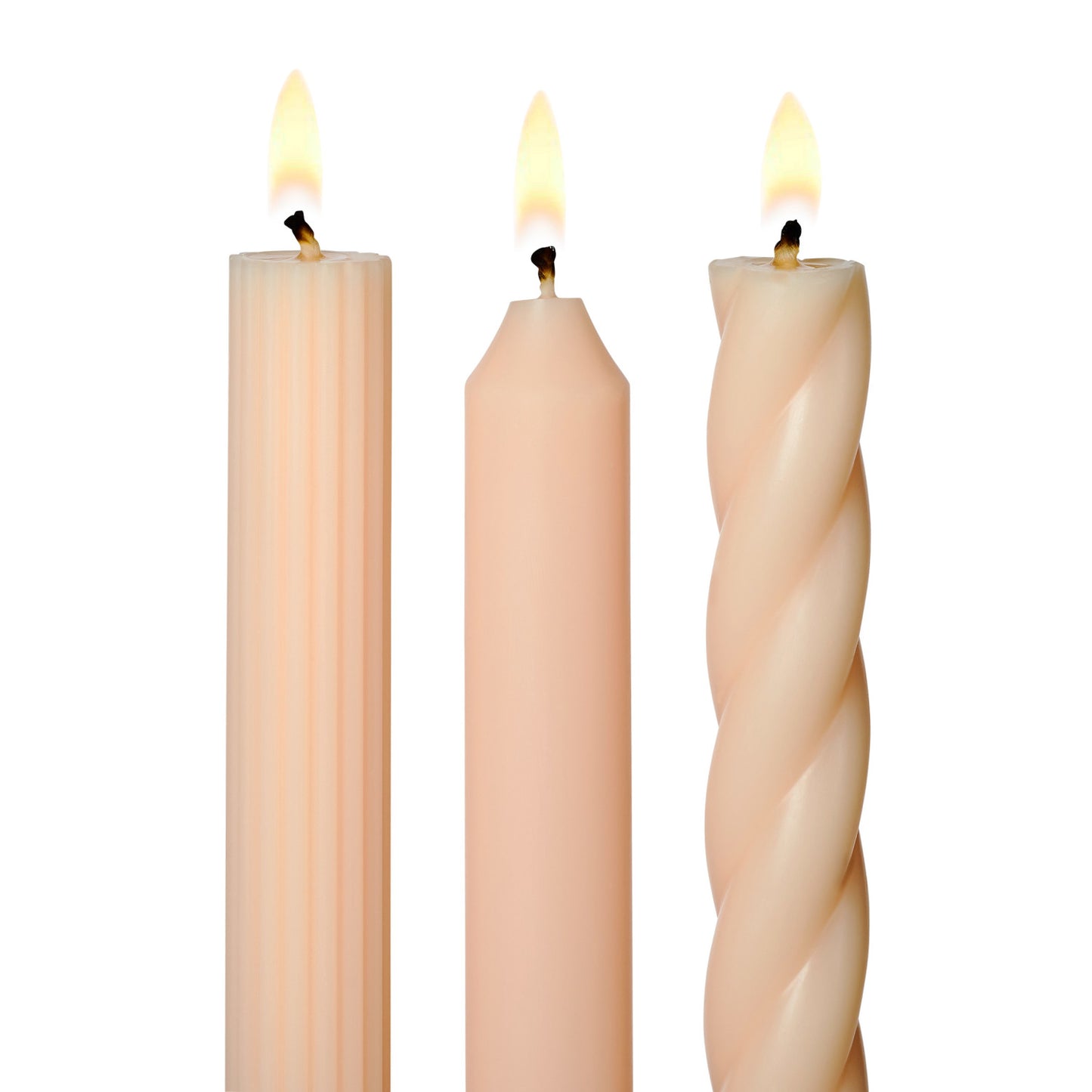 three lit assorted blush taper candles on a white background