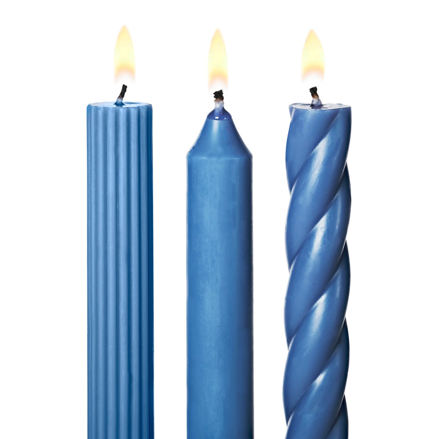 three lit assorted blue taper candles on a white background