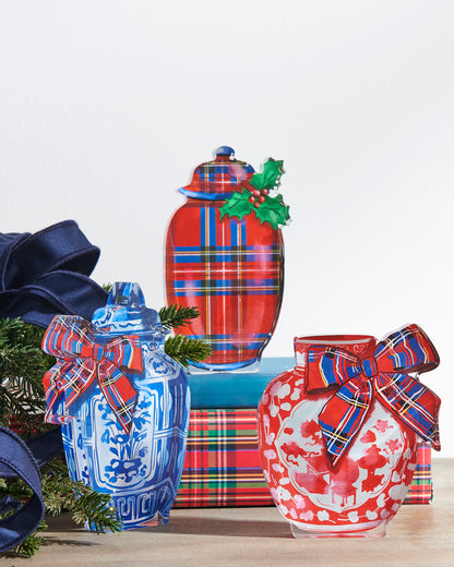 three chinoiserie blocks with plaid accents on a decorated table