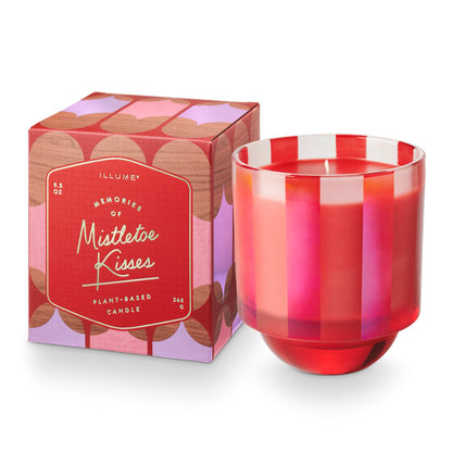 Mistletoe Kisses Glass Candle set next to its box packaging