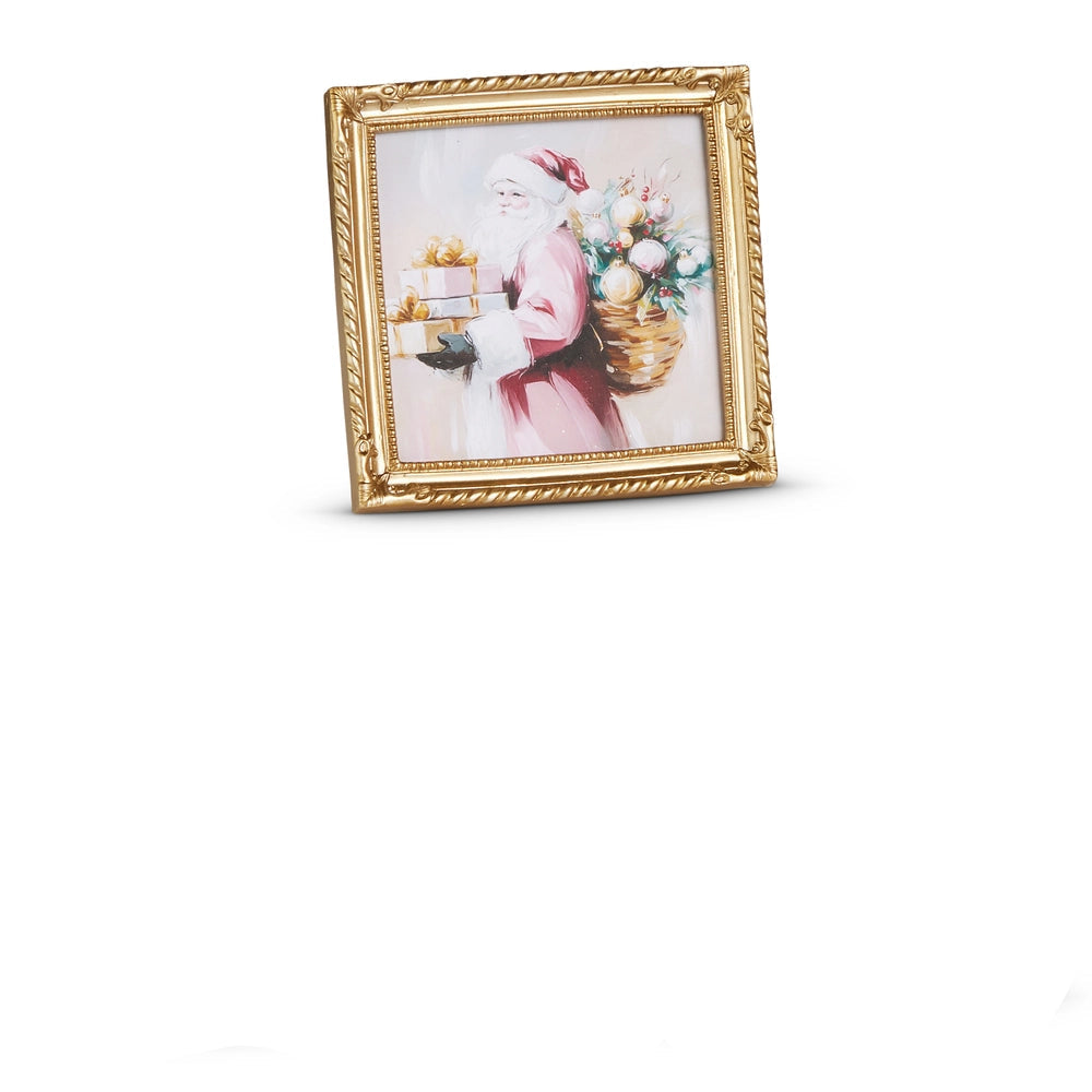 small gold frame art of santa wearing a pink suit holding a stack of gifts