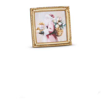 small gold frame art of santa wearing a pink suit holding a stack of gifts
