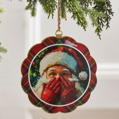 Santa's Secret Scalloped Disc Ornament hanging from a tree