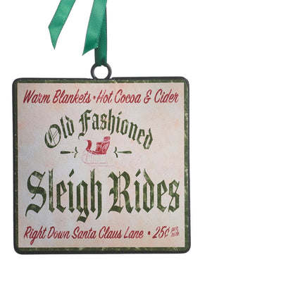 square off-white metal ornament with "old fashion sleigh rides" in aligraphy in the center and "arm blankets hot cocoa &cider" in red across the top and 'right down santa claus lane, 25 cents" in red across the bottom