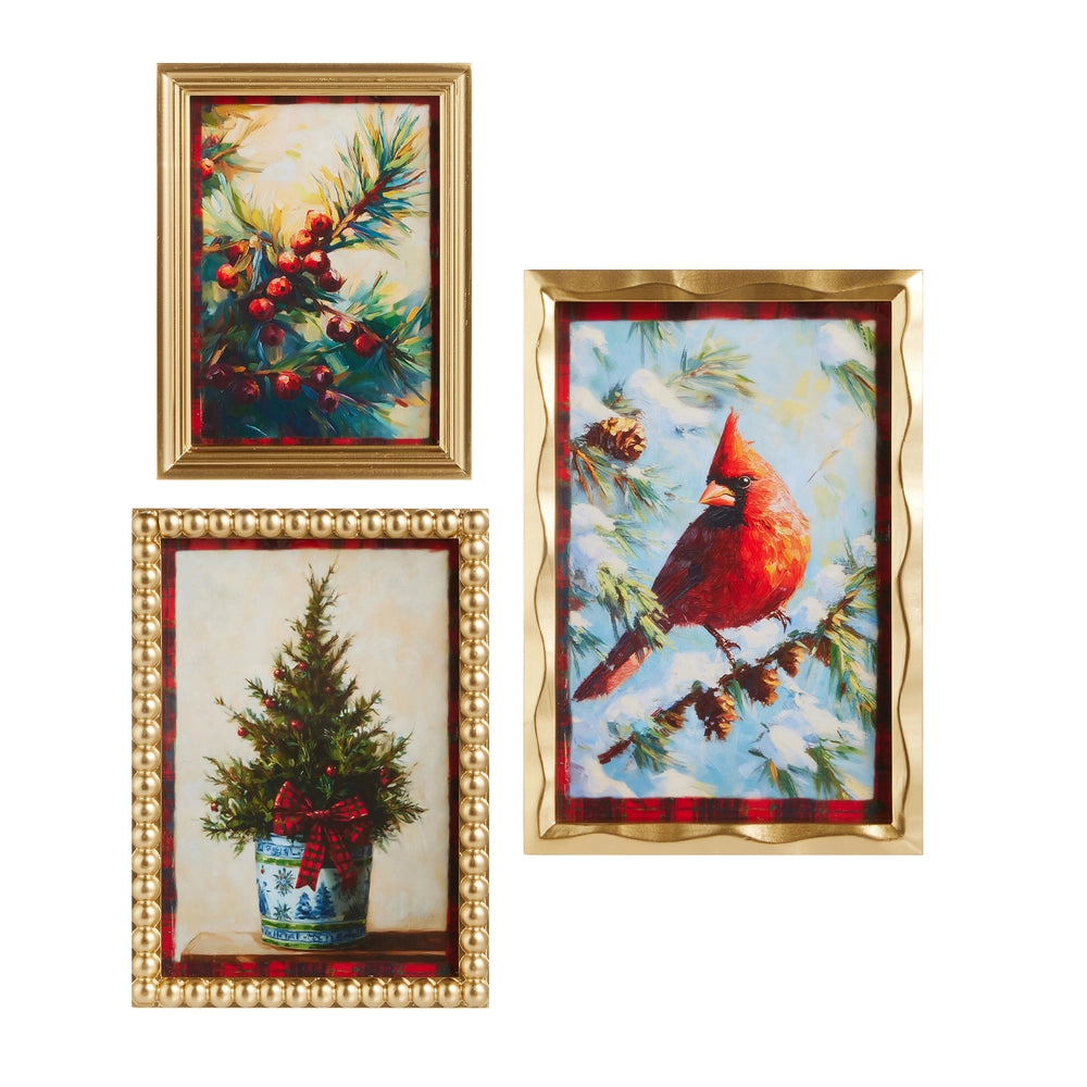 Set of three framed Christmas-themed artworks with gold frames.