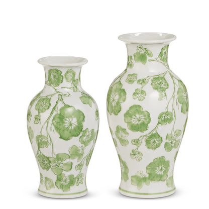 2 white vases with green cherry blossoms on them