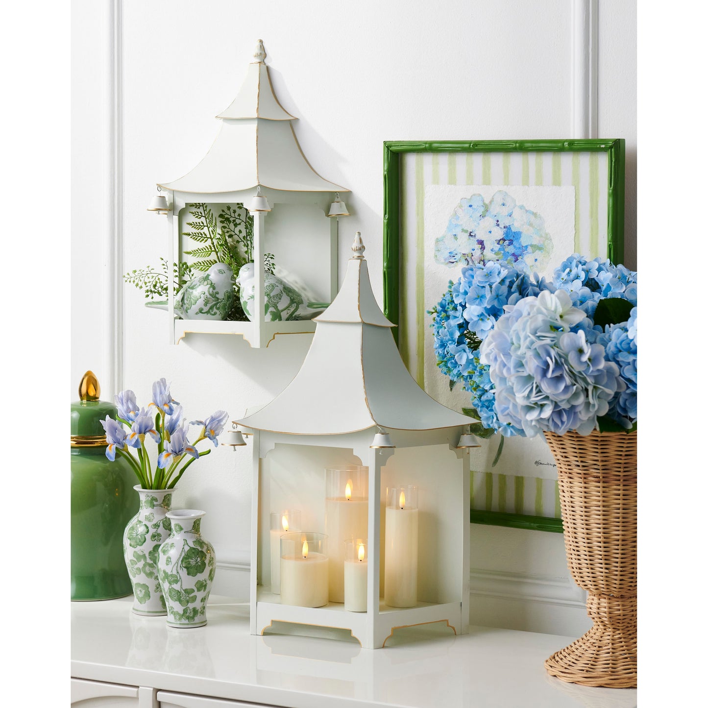 green cherry blossom vases in a decorated setting