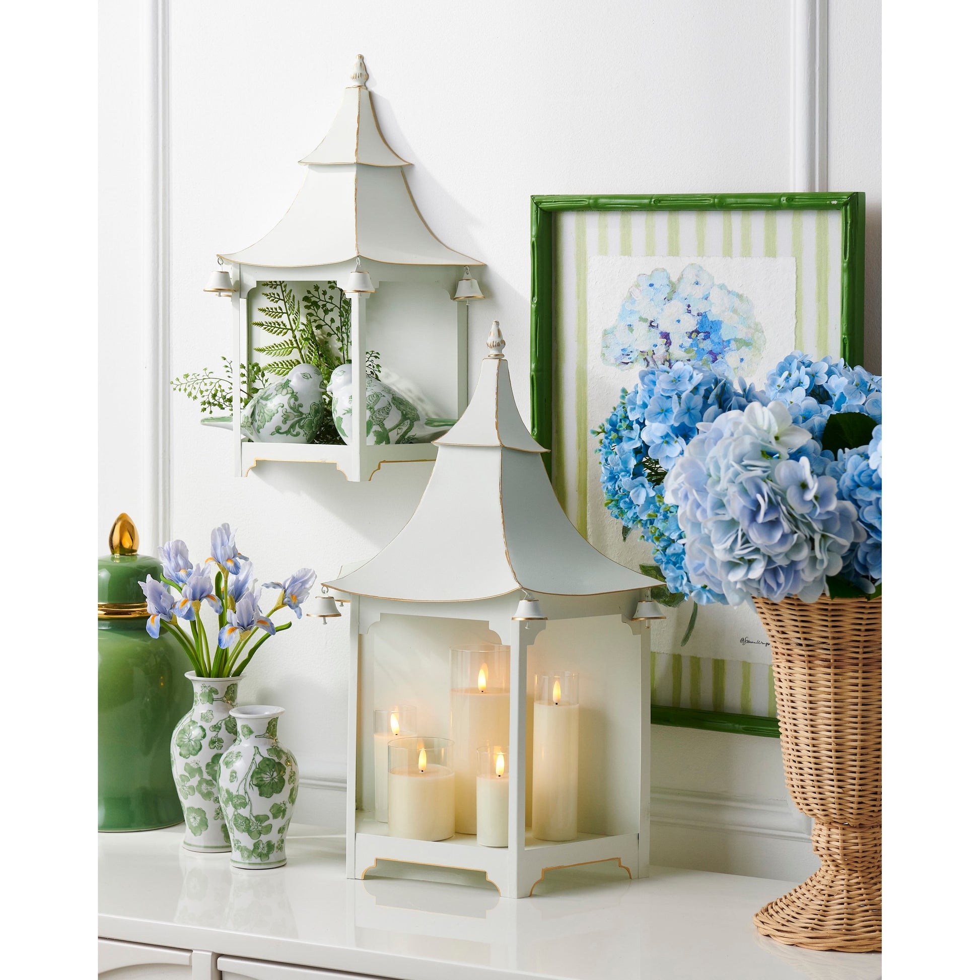 green cherry blossom vases in a decorated setting