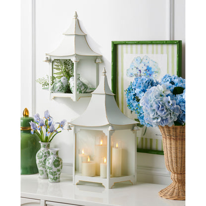 green cherry blossom vases in a decorated setting